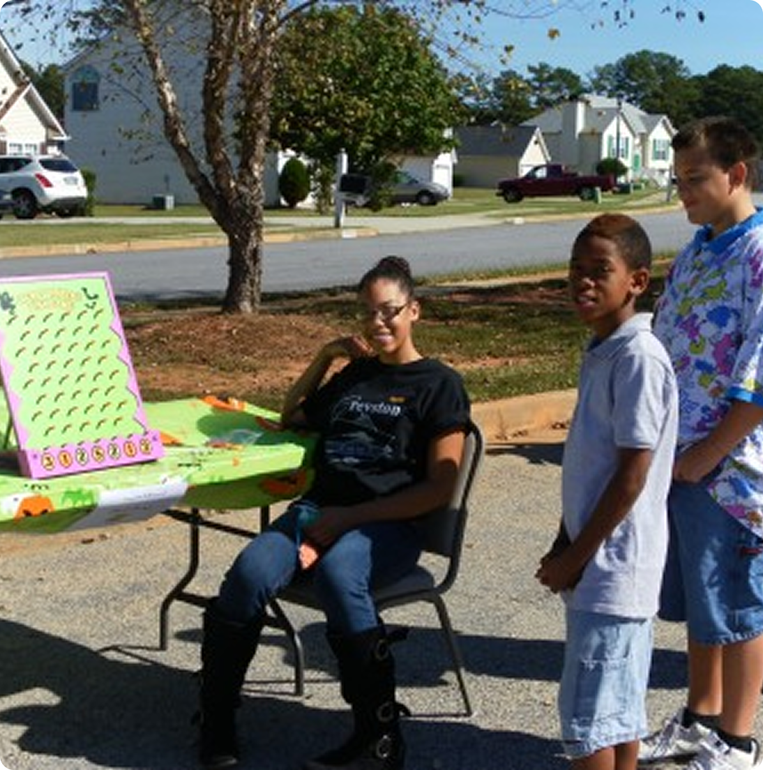 7-300x169 (1)-2 Kids playing game at outdoor table event.