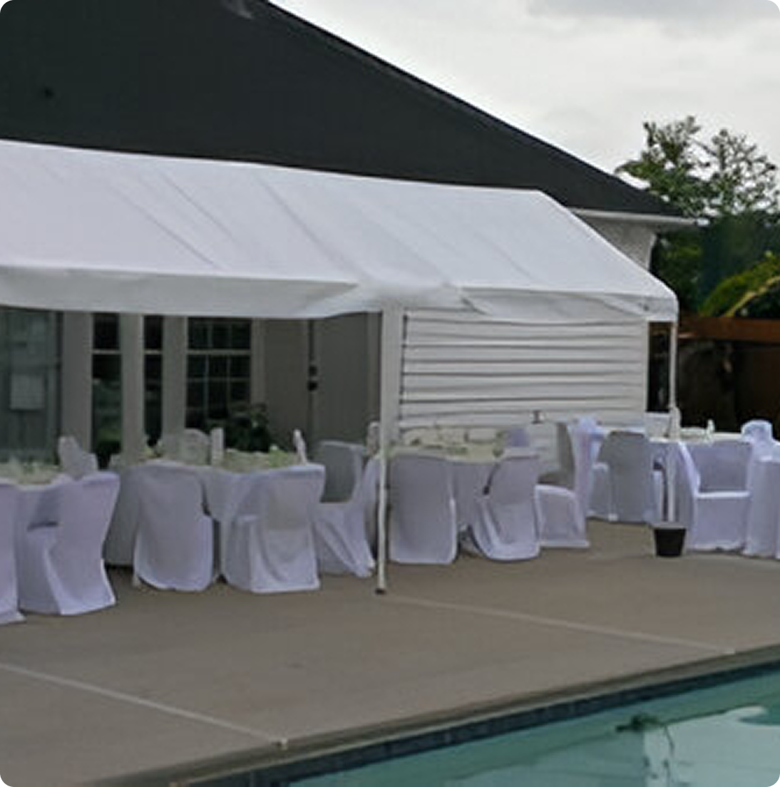 7-300x169 (1) Outdoor tented event with white covered chairs.